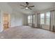 Spacious main bedroom with carpeting and lots of natural light at 1649 Woodstock Dr, Brownsburg, IN 46112