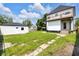 This home features a spacious backyard with an exterior garage, perfect for outdoor activities and storage at 19 E Regent St, Indianapolis, IN 46225