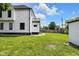 The home features a sideyard and a detached garage at 19 E Regent St, Indianapolis, IN 46225