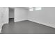 Unfinished basement area with painted walls and gray flooring, ready for your creative vision to transform the space at 19 E Regent St, Indianapolis, IN 46225