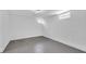 Bright basement room with finished drywall, concrete floor, and lighting, offering a versatile living space at 19 E Regent St, Indianapolis, IN 46225