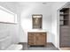 Beautiful bathroom features a modern vanity with marble countertop and a separate closet at 19 E Regent St, Indianapolis, IN 46225
