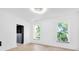 Bright bedroom boasts natural light from two windows and features a spacious walk-in closet at 19 E Regent St, Indianapolis, IN 46225