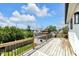 Enjoy neighborhood views from this wooden balcony with wooden and iron railings at 19 E Regent St, Indianapolis, IN 46225