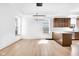 Dining room featuring hardwood floors, recessed lighting, and an adjacent kitchen at 19 E Regent St, Indianapolis, IN 46225