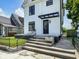Close-up of porch with steps and black awning over front door at 19 E Regent St, Indianapolis, IN 46225
