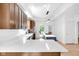 Updated kitchen features quartz countertops, tile backsplash, stainless appliances and modern lighting at 19 E Regent St, Indianapolis, IN 46225