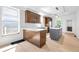 Updated kitchen with white quartz countertops, tile backsplash, and stainless steel appliances at 19 E Regent St, Indianapolis, IN 46225