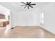 Spacious living room features recessed lighting, hardwood floors, and a ceiling fan at 19 E Regent St, Indianapolis, IN 46225