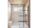 This shower features a shower bench and black-framed glass at 19 E Regent St, Indianapolis, IN 46225