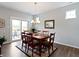 Dining room with sliding doors to patio, natural light, and views at 19657 Astoria Ave, Sheridan, IN 46069