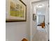 Hallway leads to bedroom, adorned with decorative artwork and neutral paint at 19657 Astoria Ave, Sheridan, IN 46069