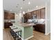 Stylish kitchen featuring island with counter seating, modern appliances, and plenty of storage at 19657 Astoria Ave, Sheridan, IN 46069