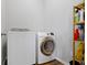 Functional laundry room featuring modern washer, dryer, and shelving at 19657 Astoria Ave, Sheridan, IN 46069