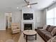 Comfortable living room with fireplace, ceiling fan, and neutral decor at 19657 Astoria Ave, Sheridan, IN 46069