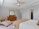 Comfortable main bedroom with ceiling fan, chaise lounge, dresser and ensuite bathroom and walk-in closet at 19657 Astoria Ave, Sheridan, IN 46069