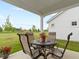 Covered patio featuring seating with a table and outdoor space for relaxing or dining al fresco at 19657 Astoria Ave, Sheridan, IN 46069