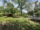 Spacious backyard featuring a shed, mature trees and a tire swing at 2015 Rosewood Dr, Anderson, IN 46011