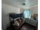 Comfortable bedroom featuring a bunk bed and a neutral color palette, with a window for light at 2015 Rosewood Dr, Anderson, IN 46011