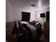 Calm bedroom with dark furniture, neutral paint color, and dark curtains with a ceiling fan overhead at 2015 Rosewood Dr, Anderson, IN 46011