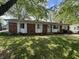 Charming single-story brick home with a well-maintained lawn and inviting front entrance at 2015 Rosewood Dr, Anderson, IN 46011