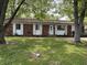 Charming single-story brick home with a well-maintained lawn and inviting front entrance at 2015 Rosewood Dr, Anderson, IN 46011