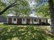 Charming single-story brick home with a well-maintained lawn and inviting front entrance at 2015 Rosewood Dr, Anderson, IN 46011