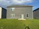 This is the home's backyard, offering grass and patio space at 2263 S Carlota Dr, New Palestine, IN 46163