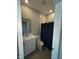 Bathroom featuring a single sink vanity, toilet, and shower with a dark curtain at 2263 S Carlota Dr, New Palestine, IN 46163