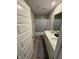 Bathroom featuring a double sink vanity, framed mirror, and a shower with a butterfly curtain at 2263 S Carlota Dr, New Palestine, IN 46163