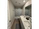 Bathroom featuring a double sink vanity, framed mirror, and a shower with a butterfly curtain at 2263 S Carlota Dr, New Palestine, IN 46163