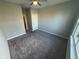 Empty bedroom featuring neutral walls, plush carpet, ceiling fan and a closet at 2263 S Carlota Dr, New Palestine, IN 46163
