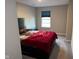Bedroom with a platform bed and a large window allowing natural light at 2263 S Carlota Dr, New Palestine, IN 46163