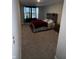 Inviting bedroom with a queen-sized bed, unique headboard, and dark window trim at 2263 S Carlota Dr, New Palestine, IN 46163
