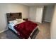 Cozy bedroom featuring a rustic wood headboard, a comfortable bed, and neutral color scheme at 2263 S Carlota Dr, New Palestine, IN 46163