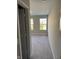 Hallway leading to a room with dual windows that let in plenty of natural light at 2263 S Carlota Dr, New Palestine, IN 46163