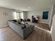 Comfortable living room featuring a large sectional sofa, a tv, and modern decor at 2263 S Carlota Dr, New Palestine, IN 46163