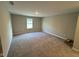 An airy room with ample space, soft carpeting and a window offering natural light at 2263 S Carlota Dr, New Palestine, IN 46163