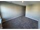 Spacious room with neutral walls and plush carpeting, offering versatility at 2263 S Carlota Dr, New Palestine, IN 46163