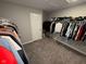 This walk-in closet offers plenty of space for hanging clothes and organizing wardrobes at 2263 S Carlota Dr, New Palestine, IN 46163