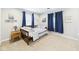 Cozy bedroom with wood trim, matching side table and nautical themed decor at 2353 E 10Th St, Anderson, IN 46012