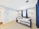 Comfortable bedroom with a daybed, soft carpet, and ample closet space for storage at 2353 E 10Th St, Anderson, IN 46012