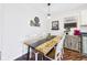 Charming dining room featuring a wooden table with white chairs, perfect for Gathering gatherings at 2353 E 10Th St, Anderson, IN 46012