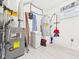 Well-maintained utility room with modern water heater and other equipment at 2353 E 10Th St, Anderson, IN 46012