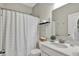 Clean bathroom featuring modern fixtures, a mirror and a white shower curtain at 247 Verdant Dr, Cicero, IN 46034