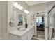 Bright bathroom featuring a double vanity with modern fixtures and tile flooring at 247 Verdant Dr, Cicero, IN 46034