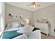Bright bedroom featuring neutral walls, ceiling fan, stylish decor and plenty of natural light at 247 Verdant Dr, Cicero, IN 46034