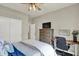 Bedroom featuring a large white closet, a desk, and a TV atop wooden drawers at 247 Verdant Dr, Cicero, IN 46034