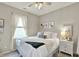 Comfortable bedroom featuring a ceiling fan, natural light, and tasteful decor at 247 Verdant Dr, Cicero, IN 46034