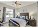 Cozy bedroom with a wooden bed frame, two night stands, and a bright window at 247 Verdant Dr, Cicero, IN 46034